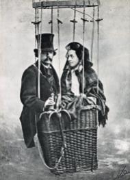 Nadar and his wife with a studio shot of hot air balloon (In 1856 he did actually go aloft in a balloon over Paris and took the world's first aerial photograph)